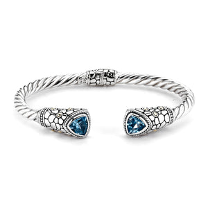 SILVER/18K TWISTED HINGED BANGLE W/ PEBBLE DESIGN BLUE TOPAZ ENDS